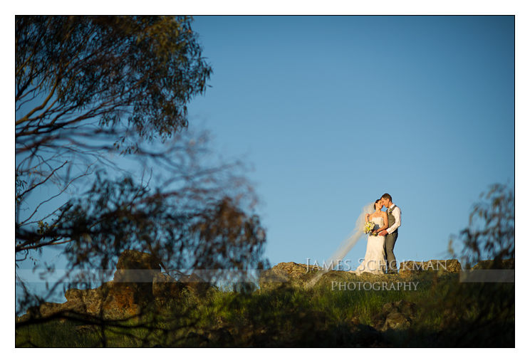 bride and groom on top of a mountain in the countryside perth